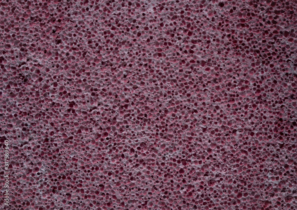 Pink pumice stone texture close up. Porous pumice background. Pink pumice stone texture close up. Porous pumice background.