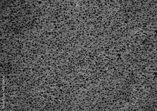 Gray pumice stone texture close up. Porous pumice background. photo