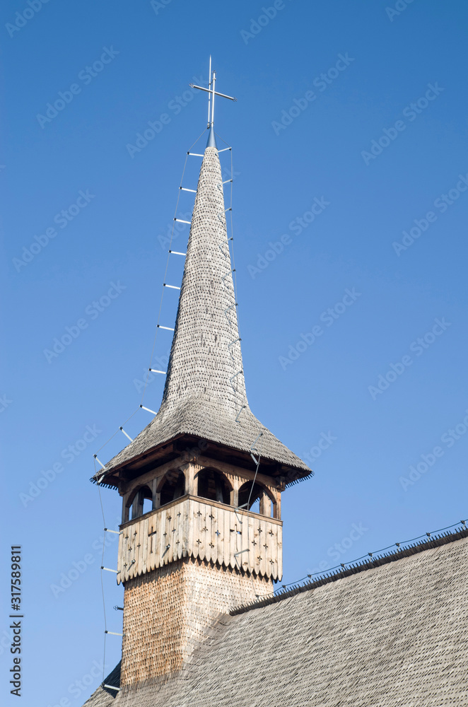 Belfry of wooden orthodox church of St. Basil the Great in Curtea de Arges, Romania
