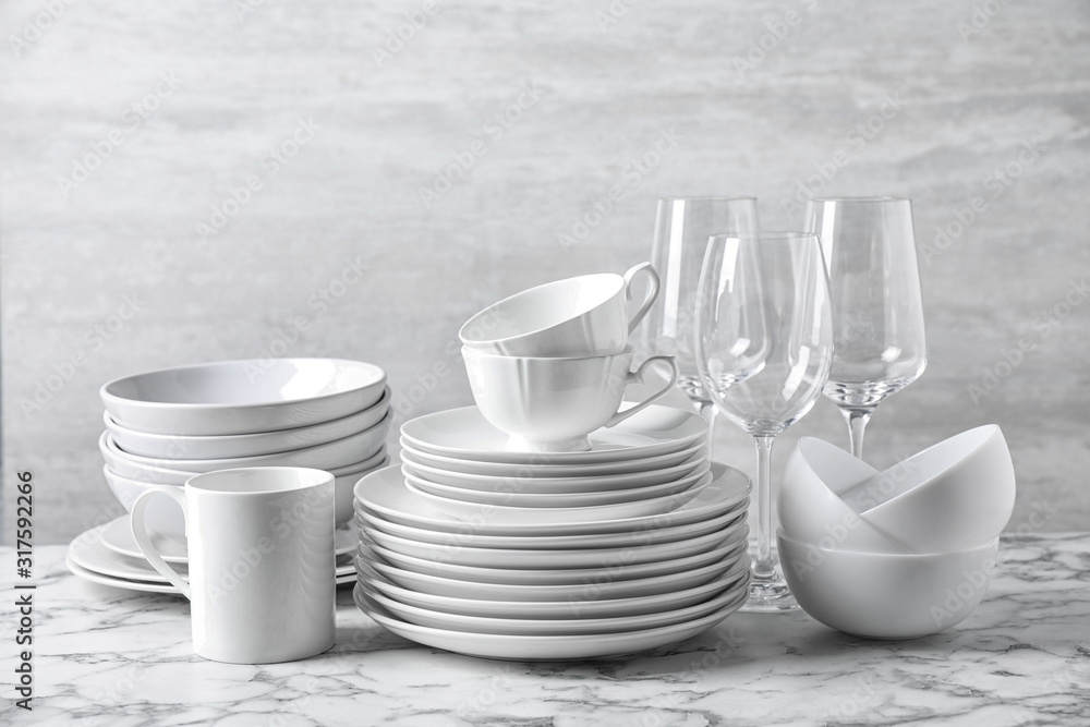 Set of clean dishware on marble table Set of clean dishware on marble table