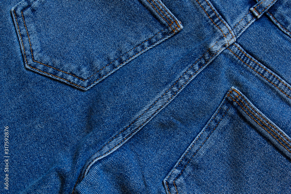 part of jeans with beautiful embossed stitching, seam, fabric texture, close-up, copy space part of jeans with beautiful embossed stitching, seam, fabric texture, close-up, copy space