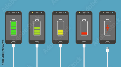 Set of smartphones with battery charge level indicators and charger connection.