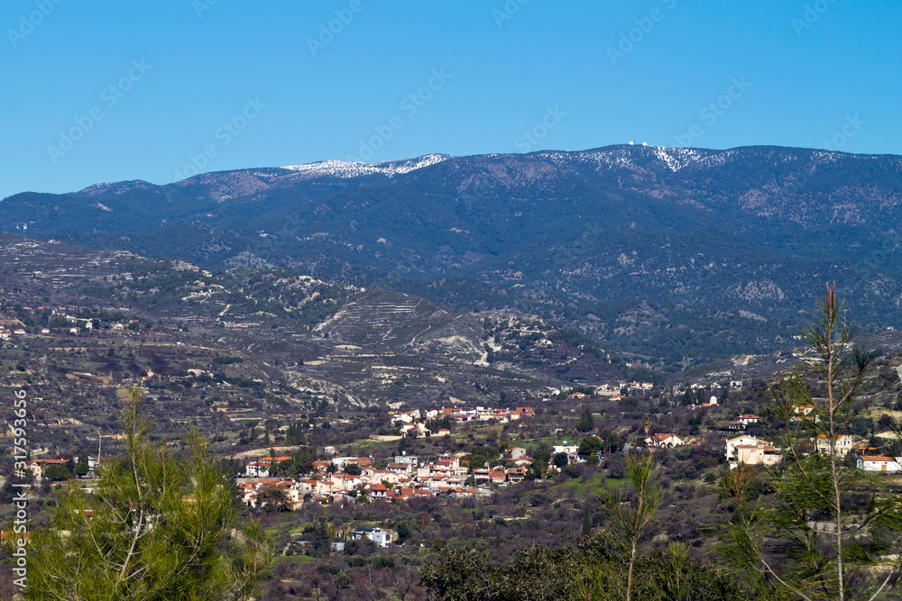 View of mountains and village in winter