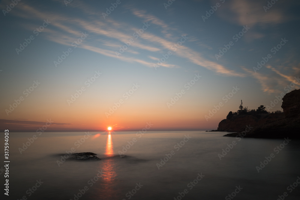 Fototapeta premium sunset on the beach with long exposure