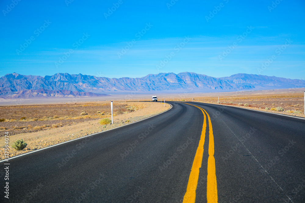 Death Valley Junction, California - November 11, 2019: Road on the way to Death Valley National Park in California, USA Death Valley Junction, California - November 11, 2019: Road on the way to Death Valley National Park in California, USA
