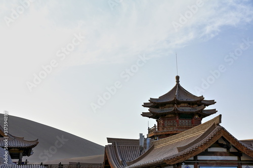 Upper upturned eaves-Chinese pagoda and surrounding pavilions overlooking Crescent Lake.Dunhuang-Gansu-China-0663