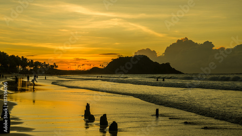 Beautiful fiery sunset on Nacpan beach, Palawan, Philippines