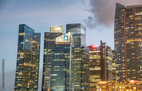 SINGAPORE - JANUARY 4, 2020: Night skyline and city buildings of Downtown © jovannig