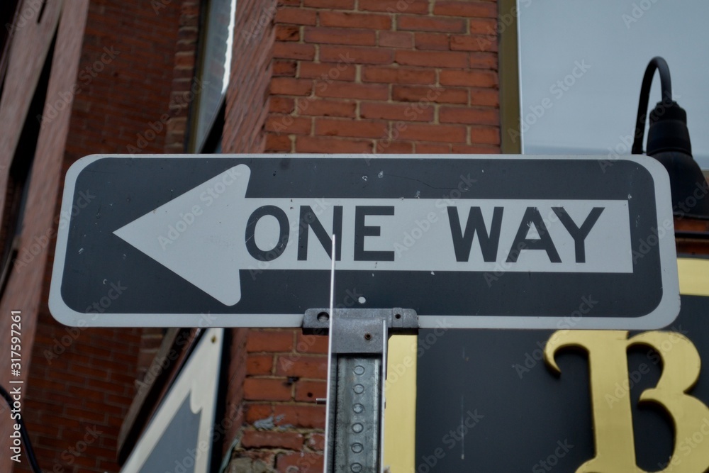 Downtown one way road sign pointing to the left in Boston Downtown one way road sign pointing to the left in Boston