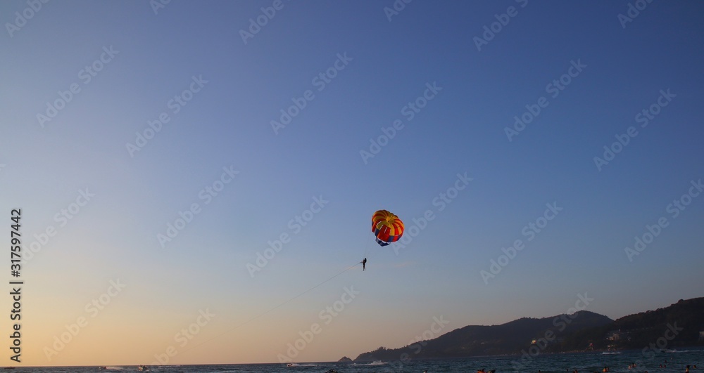 Parasailing at Patong Phuket Thailand at Sunset beautiful colours Parasailing at Patong Phuket Thailand at Sunset beautiful colours