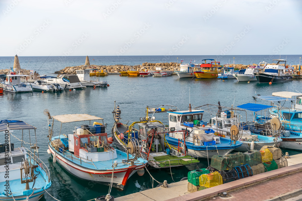 CYPRUS, PROTARAS - MAY 11/2018: Fishermen moored their boats at the pier in the village.
