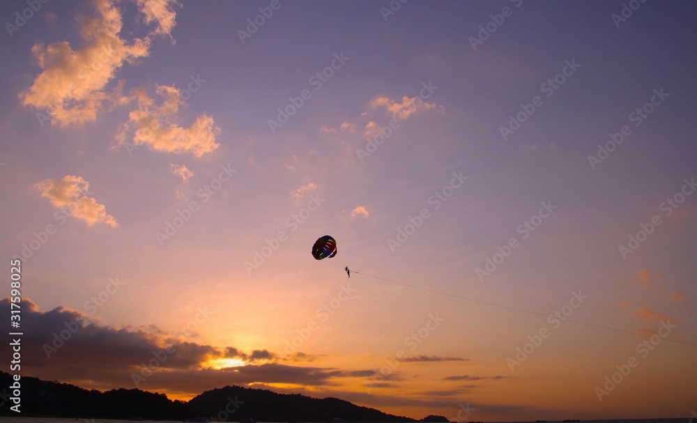 Parasailing at Patong Phuket Thailand at Sunset beautiful colours