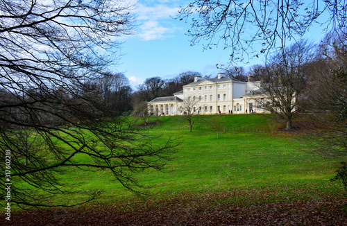 Kenwood House, also known as Iveagh Bequest, on north end of Hampstead Heath, a large wild park in London, UK. The estate served as a private residence previously and houses a museum now photo