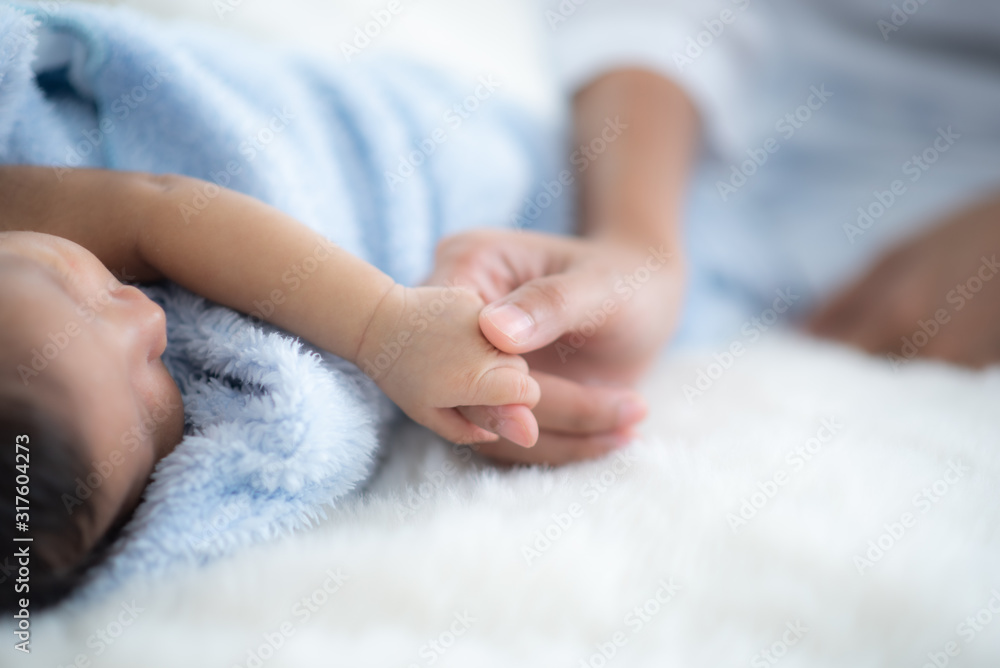 The baby is sleeping on a soft mattress The baby is sleeping on a soft mattress