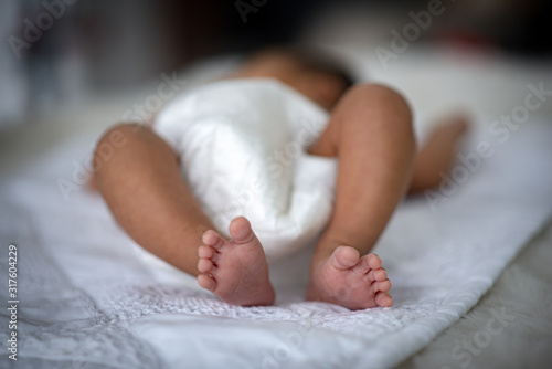 The baby is sleeping on a s...