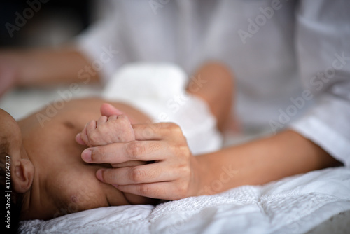 The baby is sleeping on a s...