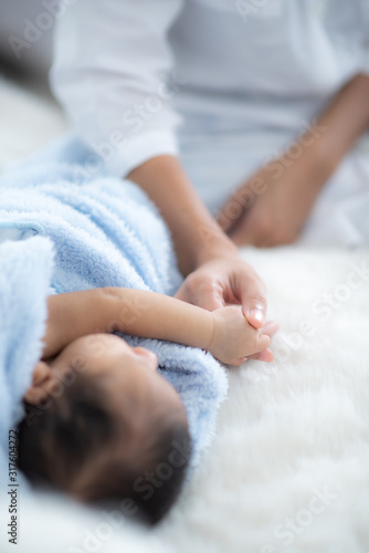 The baby is sleeping on a s...