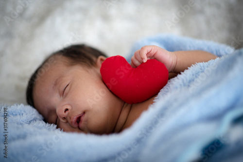 The baby is sleeping on a s...