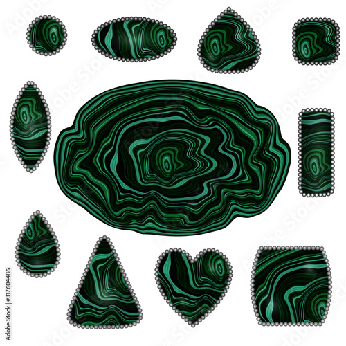 Large piece of malachite and different shapes cabochons made from it.