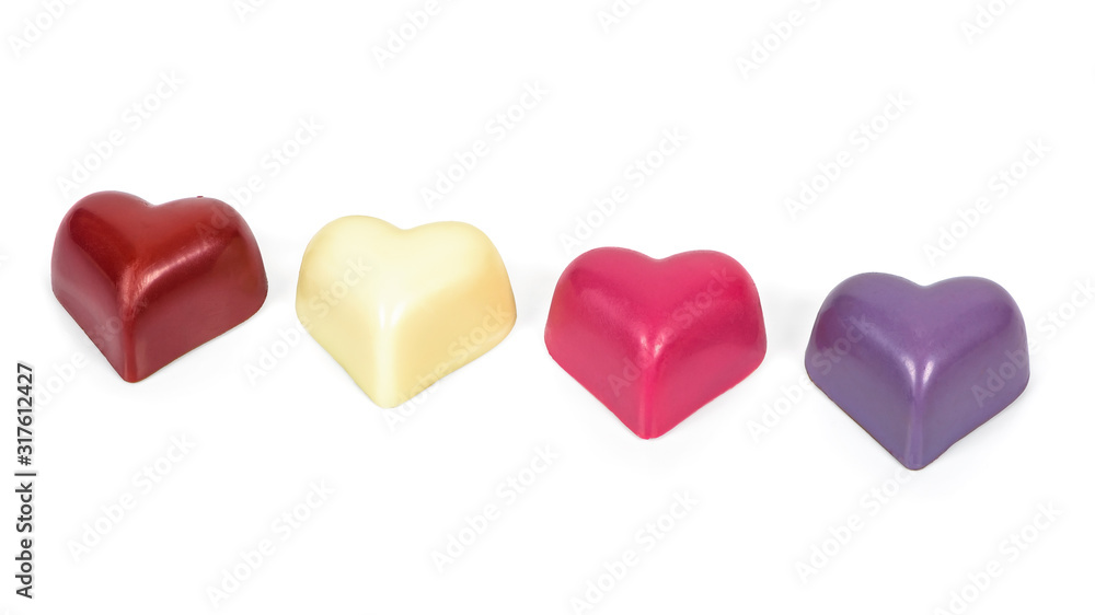 Colorful heart shaped chocolates on white background Colorful heart shaped chocolates on white background