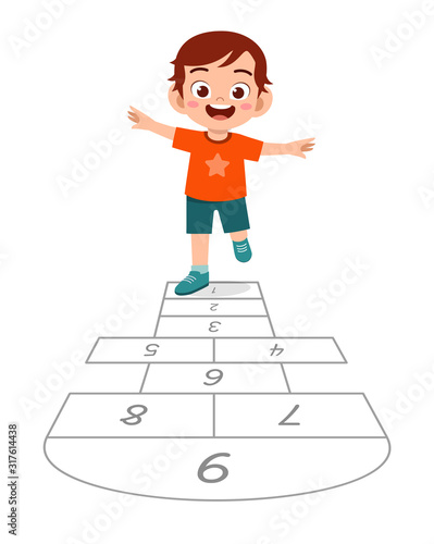 happy cute little kid boy play hopscotch