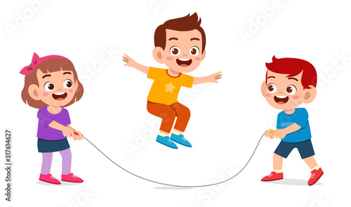 happy cute kid boy and girl play jump rope