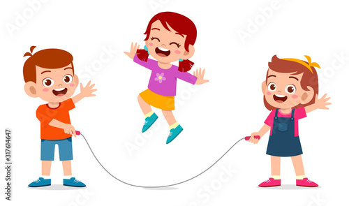 happy cute kid boy and girl play jump rope