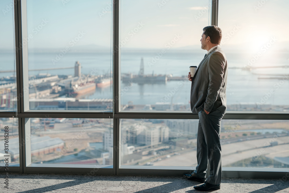 Enjoying the view from his office window Enjoying the view from his office window