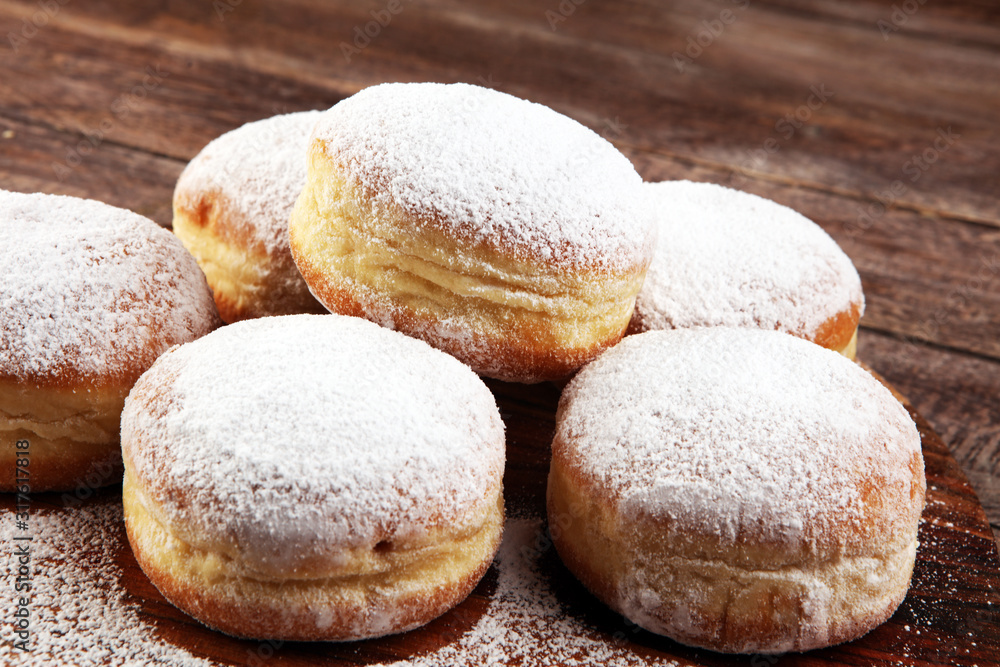 German donuts with jam and icing sugar. Carnival powdered sugar raised donuts for party German donuts with jam and icing sugar. Carnival powdered sugar raised donuts for party