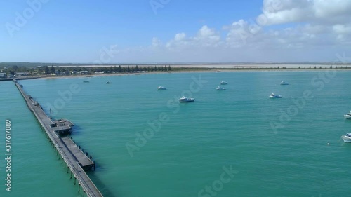 Wallpaper Mural Aerial pan across Beachport Jetty and vivid turquoise ocean water in South Australia Torontodigital.ca