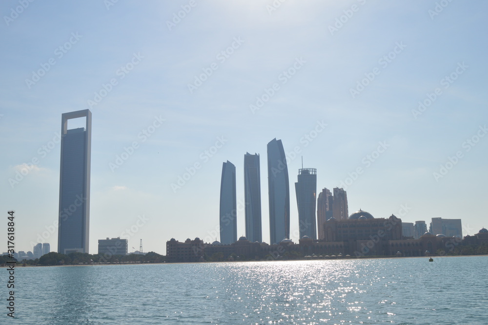 Naklejka premium Abu Dhabi city skyline along Corniche beach taken from a boat