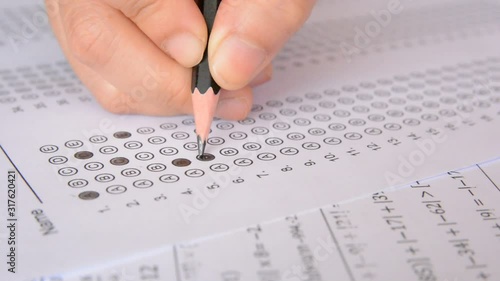 the student fills in answers on the standardized multiple choice test photo