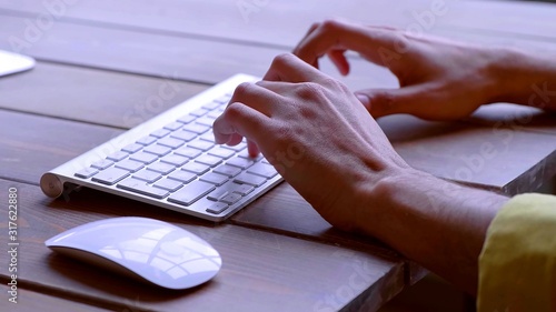Foto Hands are writing on a keyboard