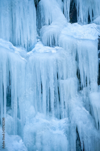 Icicles Hanging Down From a Hillside. Freezing temperatures make for an icy landscape along a mountain road in British Columbia  Canada.