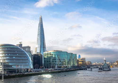 Buildings and The Shard London United Kingdom skyline view along the river Thames on a winter day