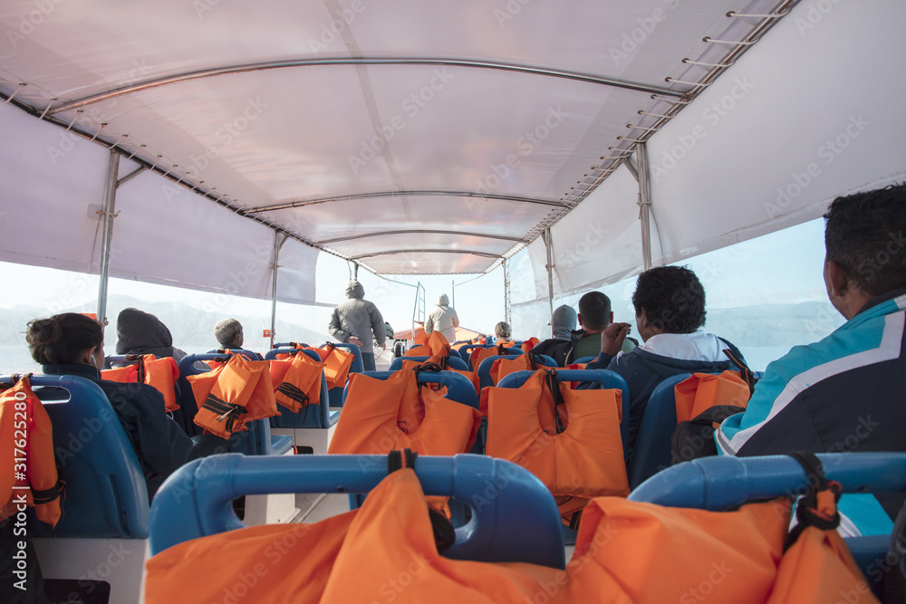 Fototapeta premium Passenger transportation with boat, taxi boat trip from Abraao, on the tropical Ilha Grande to Angra dos Reis, in the south of Rio de Janeiro Brazil