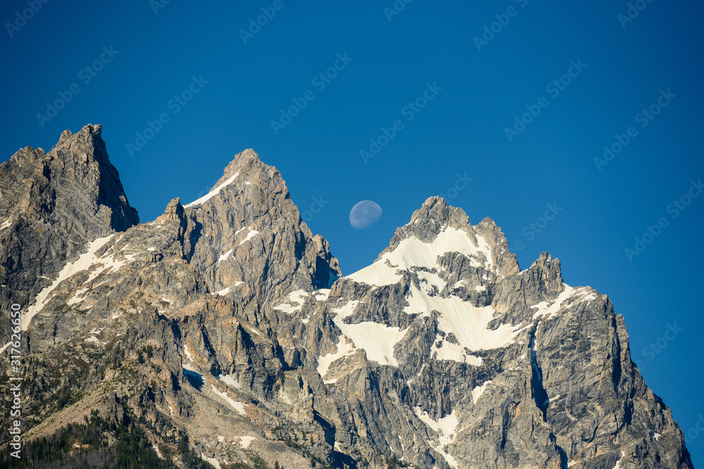 Faint Moon Behind Grand Teton Peaks