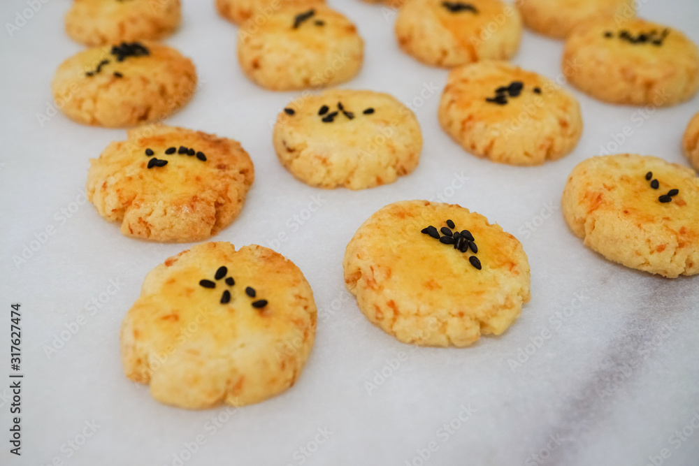 traditional homemade  coconut cookies with black sesame in white background 