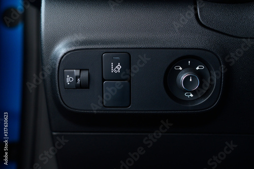 Panel  for controlling mirrors in a new car. © pazyuk