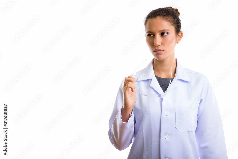 Young beautiful woman doctor as scientist thinking while holding protective glasses Young beautiful woman doctor as scientist thinking while holding protective glasses