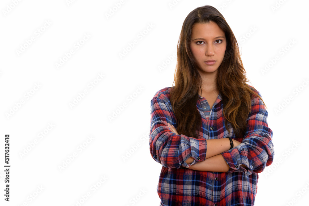 Studio shot of young beautiful woman with arms crossed Studio shot of young beautiful woman with arms crossed