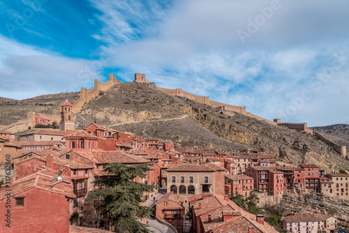 Aerial panorama view of Albarracin in Teruel Spain, with red sandstone terracotta medieval houses, Moorish castle and ancient city walls voted most beautiful Spanish village