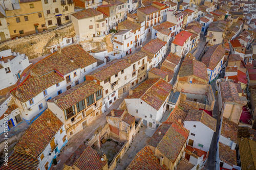 Aerial view of colorful waving, curving rooftops in Alcala del Jucar Albacete Province Spain