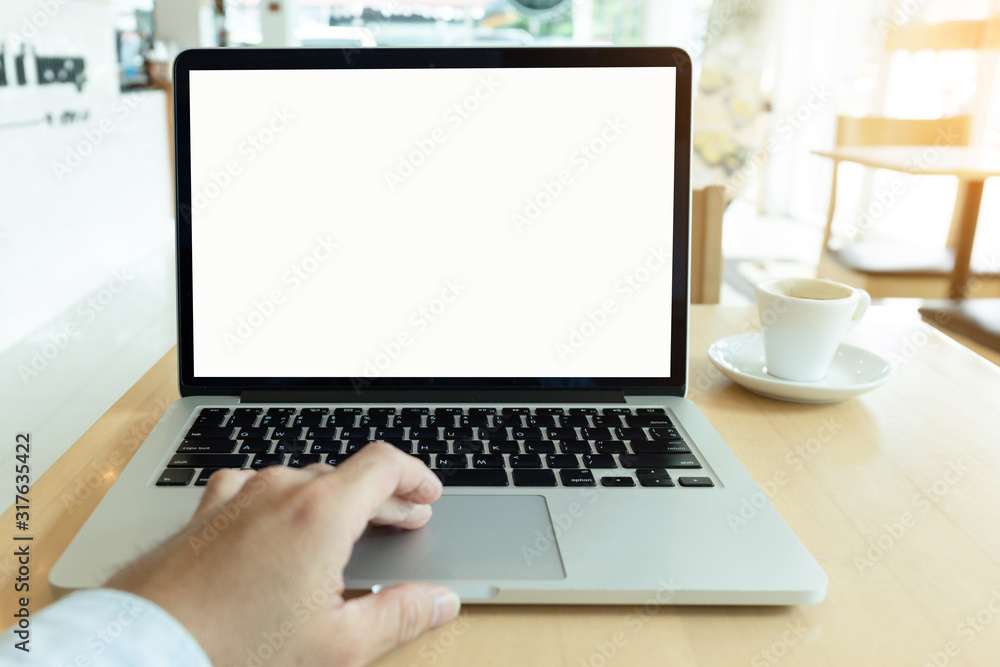 mockup image blank screen computer with white background for advertising text,hand man using laptop contact business search information on desk at coffee shop.marketing and creative design mockup image blank screen computer with white background for advertising text,hand man using laptop contact business search information on desk at coffee shop.marketing and creative design