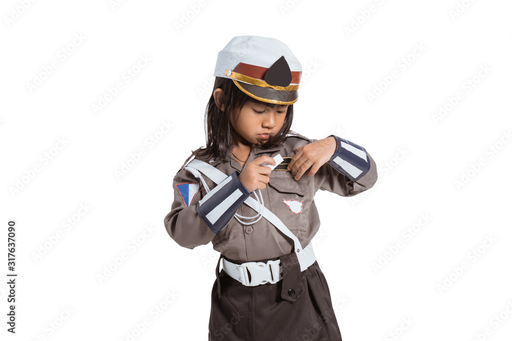 police girl wearing a uniform is putting a whistle in her pocket on white background police girl wearing a uniform is putting a whistle in her pocket on white background