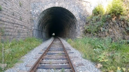 Time lapse of fast movement through the dark railway tunnel. Hyperlapse