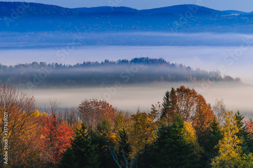 Morning sunrise during fall foliage season, Stowe, Vermont, USA © Don Landwehrle