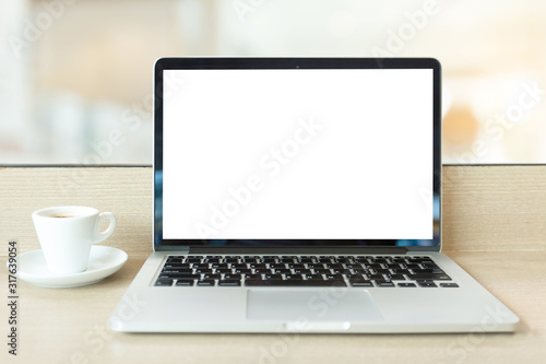 mockup image blank screen computer with white background for advertising text,hand woman using laptop contact business search information on desk at coffee shop.marketing and creative design