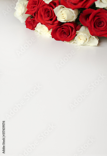 Bunch of red and white roses on blank surface with copy space for text. Backdrop for Saint Valentine s Day  International Women s Day  Mother s Day. Romantic greeting card  poster  invitation template