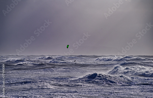 kitesurfing in high surf on the Pacific Ocean